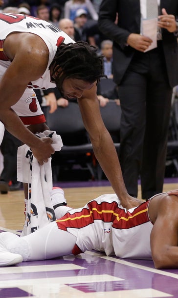 Kings come back from 11 down in fourth to beat Heat 102-96